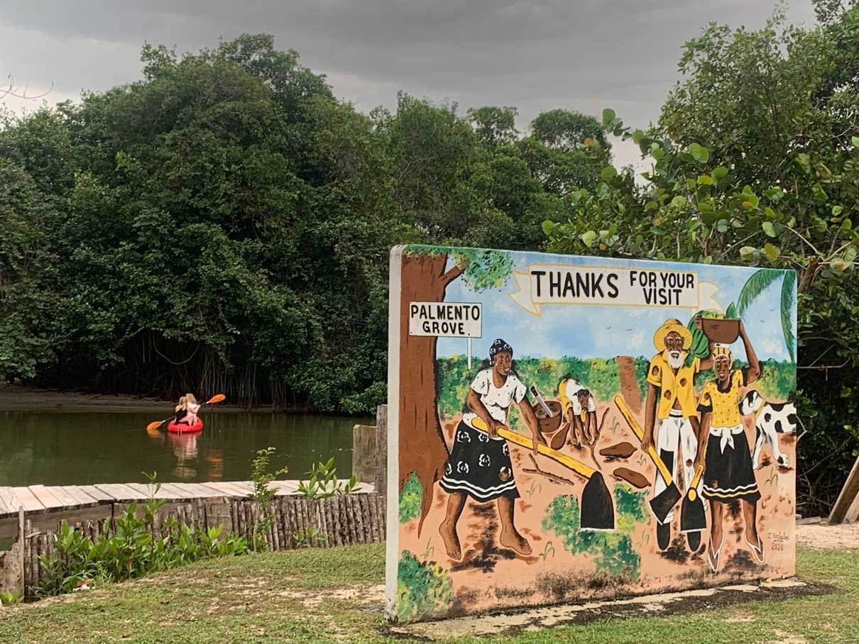 Painted "Thanks for your visit" mural at the Palmento Grove kayak launch, Hopkins, Belize
