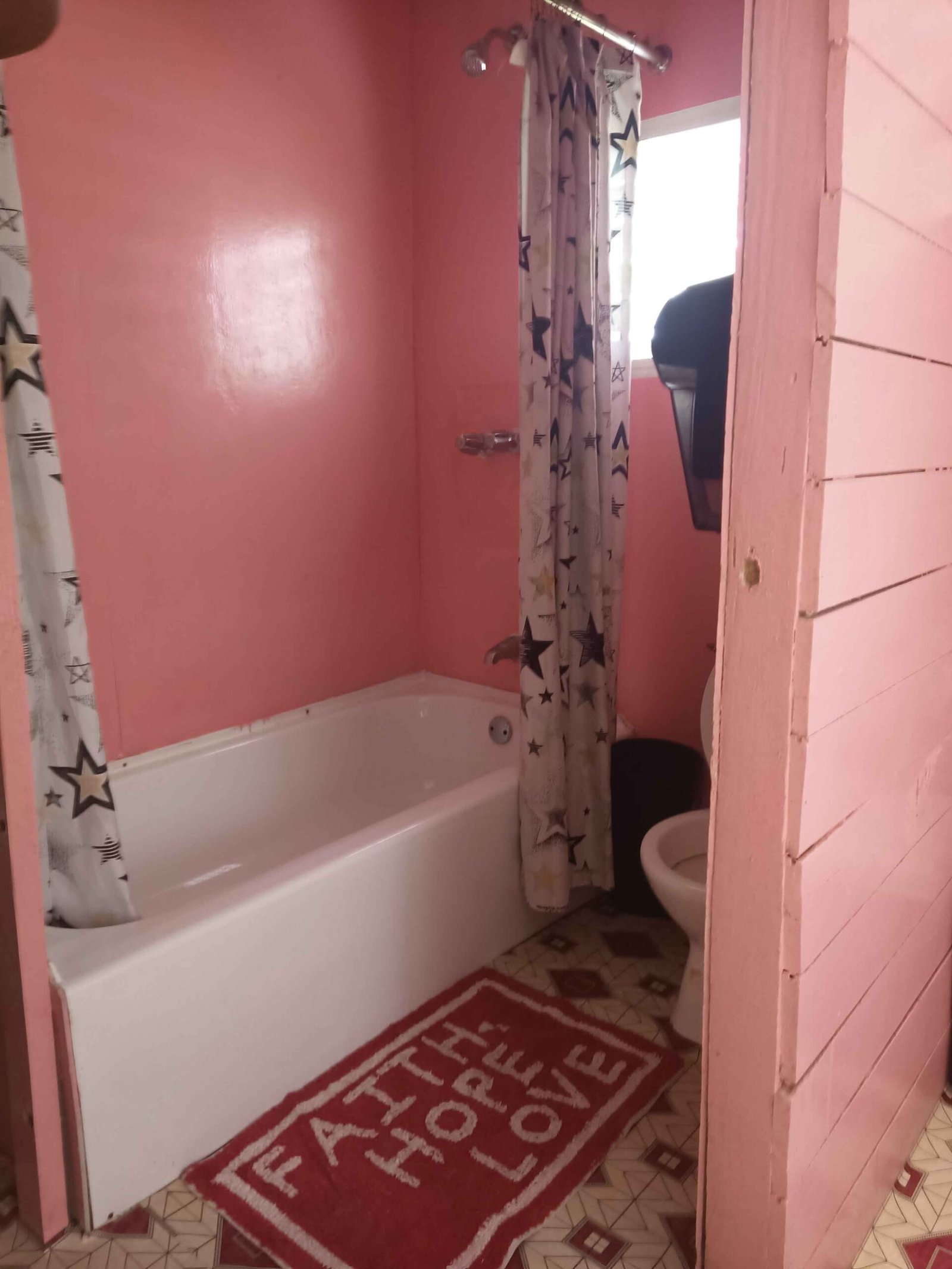 The private bathroom in a guest cabin at Palmento Grove, with a bathtub and shower