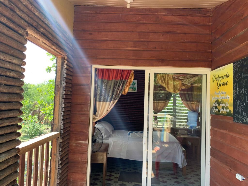 The porch of a guest cabin looking through to the room, Palmento Grove