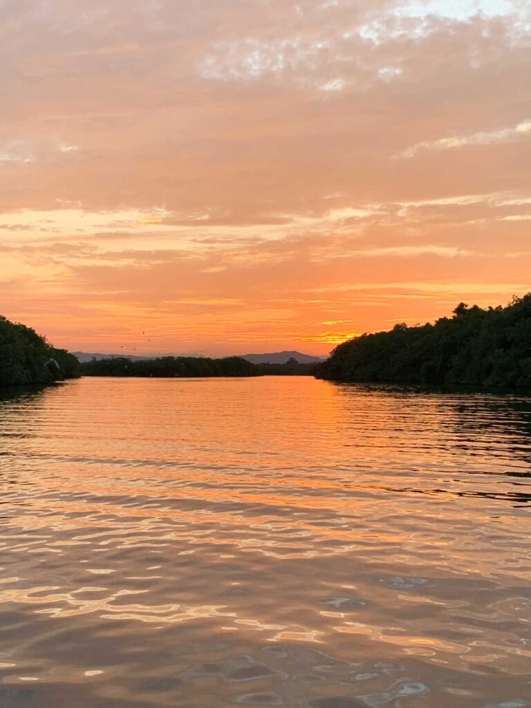 Sunset over the lagoon seen from a kayak near Hopkins, Belize