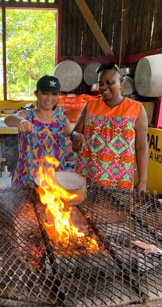 Cooking over the open fire at Palmento Grove, Hopkins, Belize