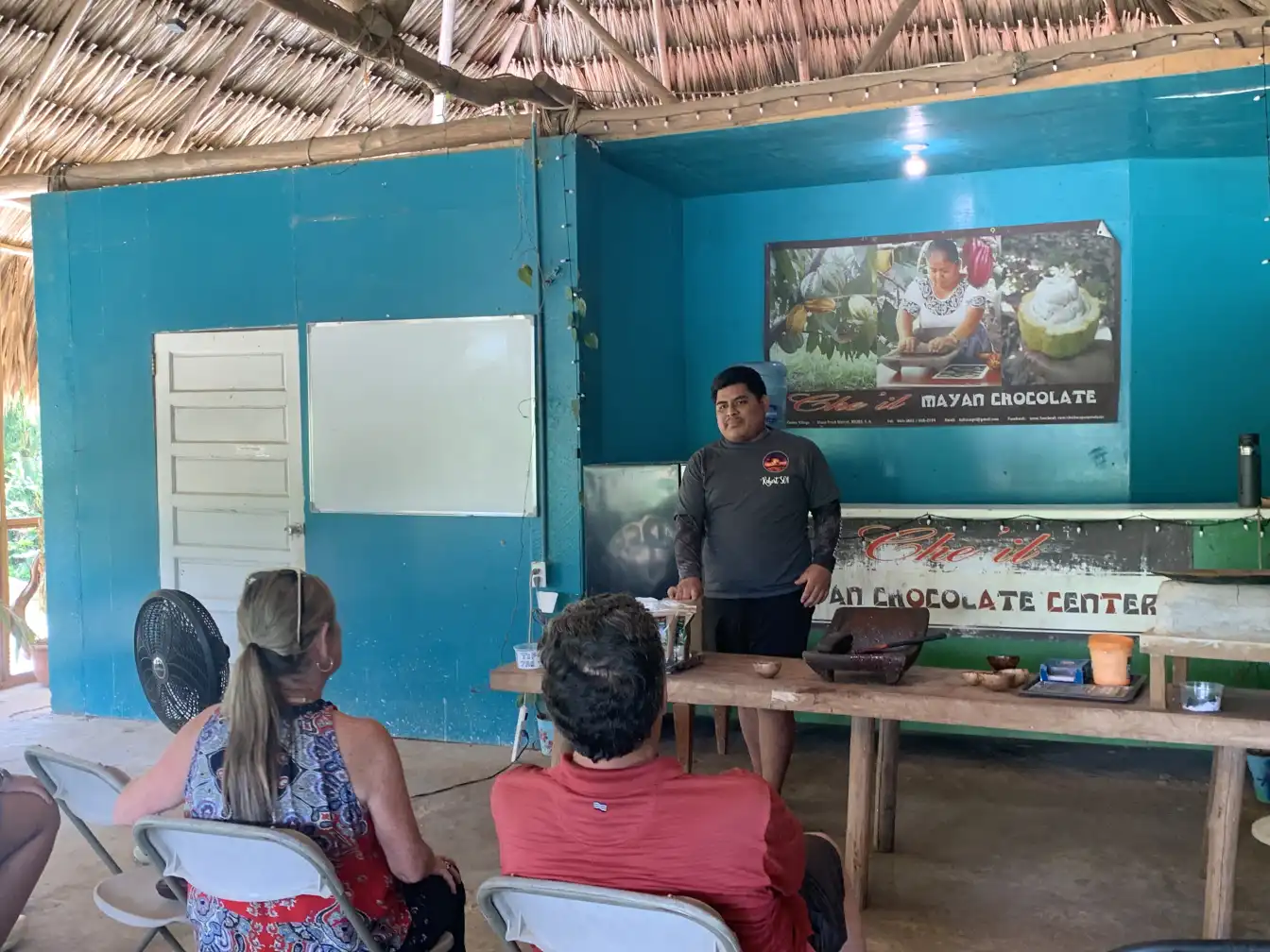 Guests at a chocolate-making talk inside the Maya chocolate centre, Maya Center, Belize