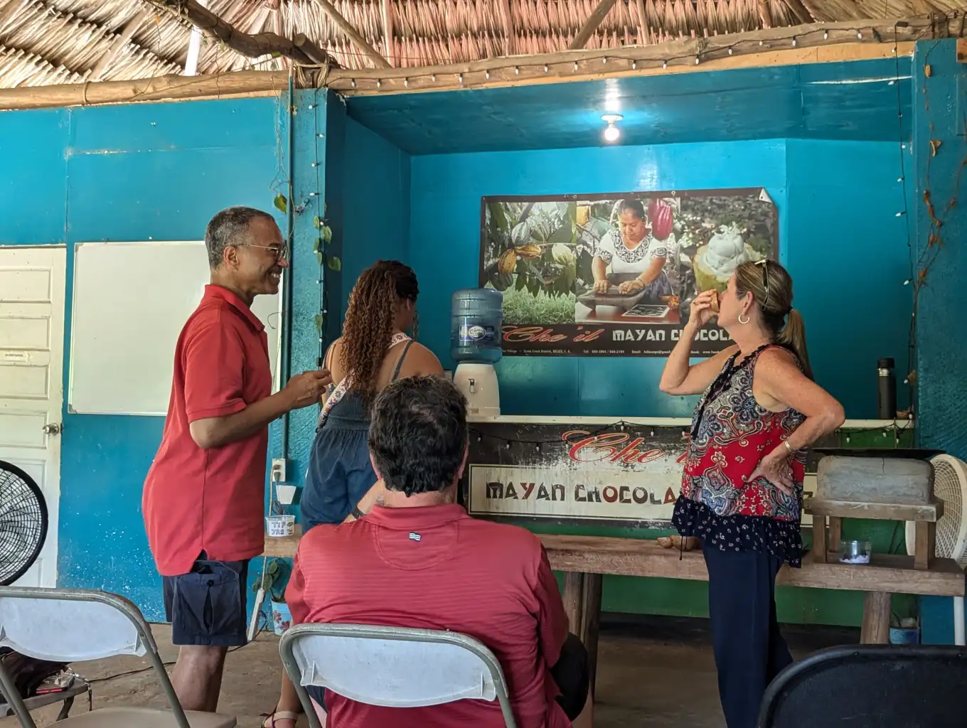 Visitors touring the Maya chocolate centre in Maya Center village, Belize