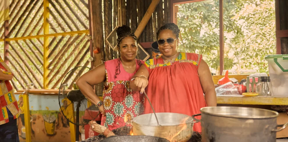 Guests cooking together over open fire pots at Palmento Grove
