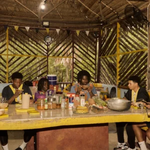 Guests sharing a Garifuna meal together at the long table at Palmento Grove
