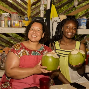 The Garifuna drum pavilion with drummers playing at Palmento Grove, Hopkins, Belize