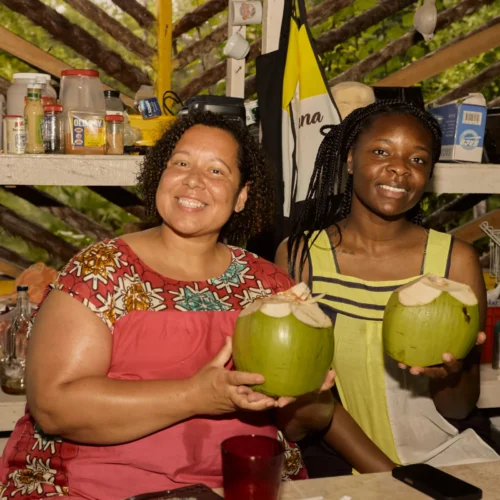 The Garifuna drum pavilion with drummers playing at Palmento Grove, Hopkins, Belize