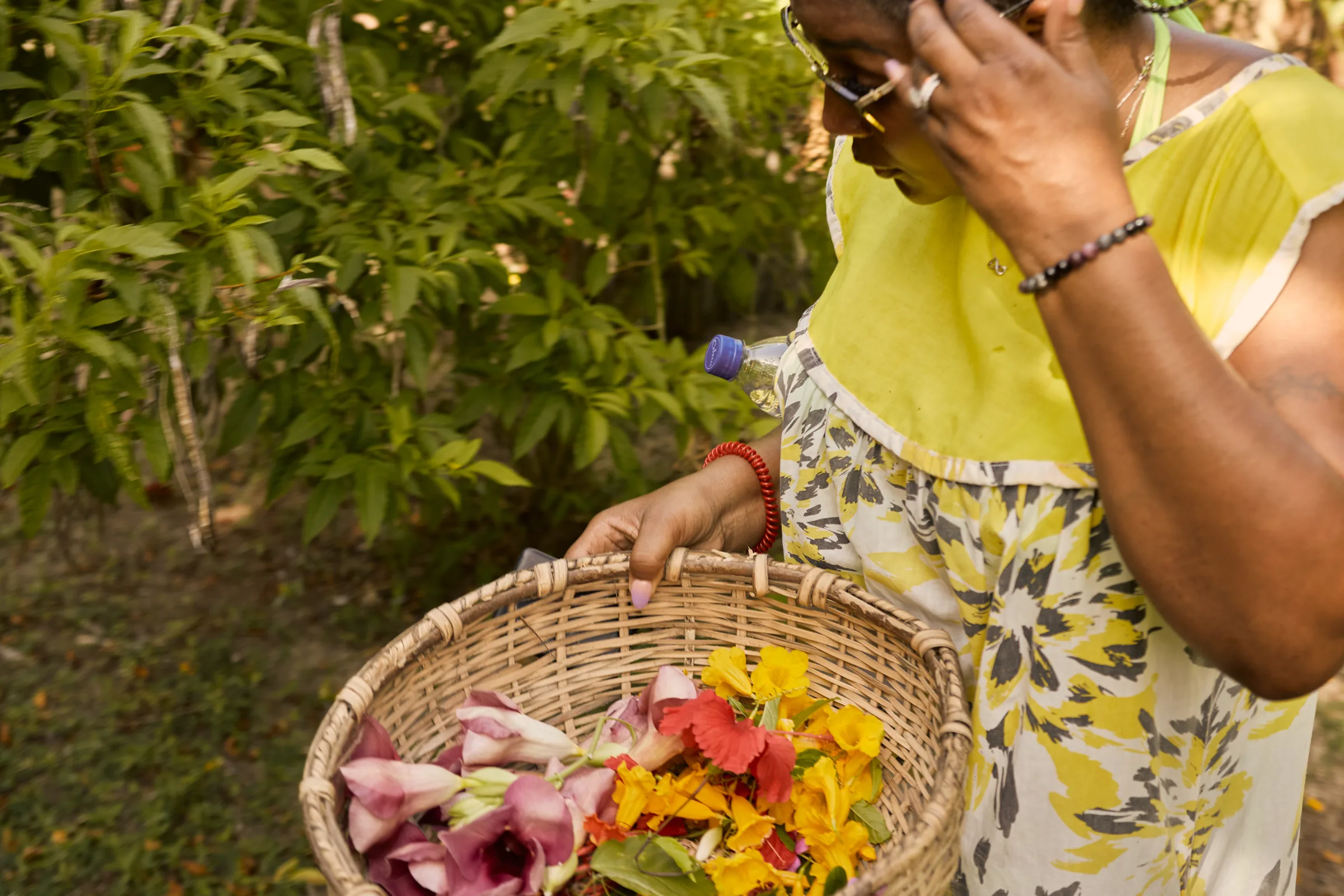 Freshly picked herbs and flowers in a basket in the garden at Palmento Grove