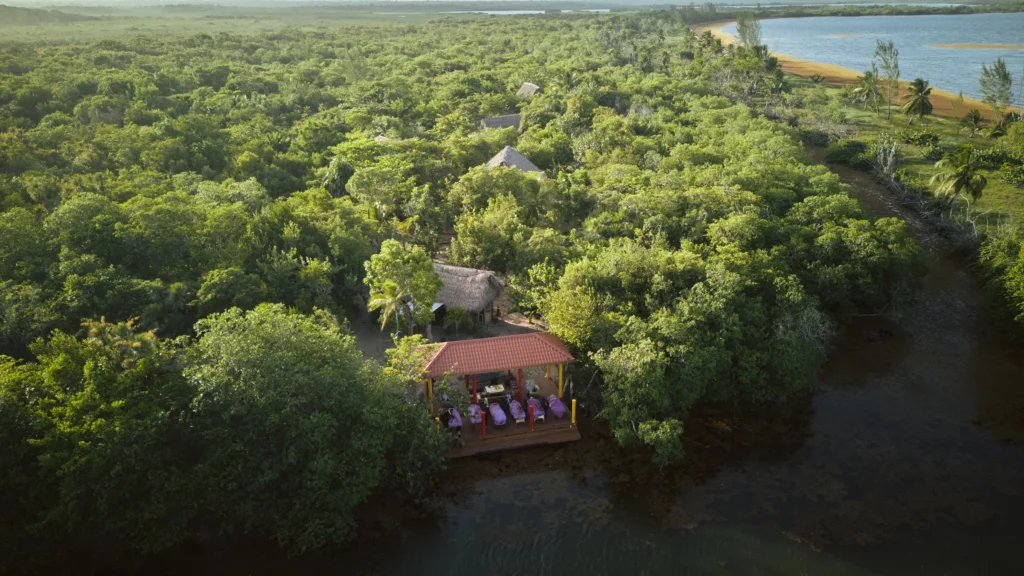 Palmento Grove from the air — the island lodge and massage pavilion on Freshwater Creek Lagoon, Hopkins, Belize
