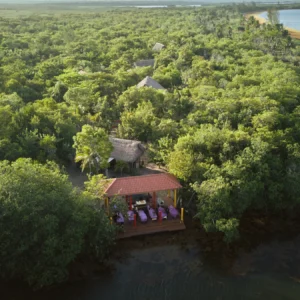 Palmento Grove from the air — the island lodge and massage pavilion on Freshwater Creek Lagoon, Hopkins, Belize