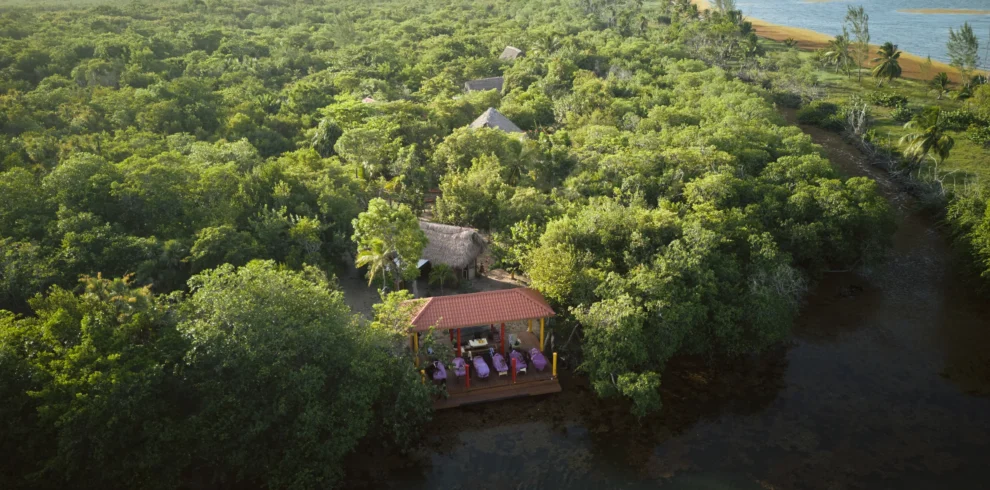 Palmento Grove from the air — the island lodge and massage pavilion on Freshwater Creek Lagoon, Hopkins, Belize