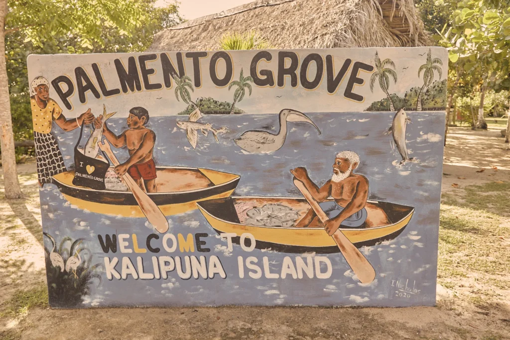 The hand-painted Welcome to Kalipuna Island sign at Palmento Grove, Hopkins, Belize