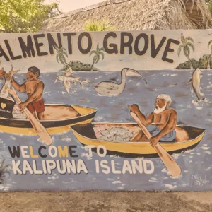 The hand-painted Welcome to Kalipuna Island sign at Palmento Grove, Hopkins, Belize