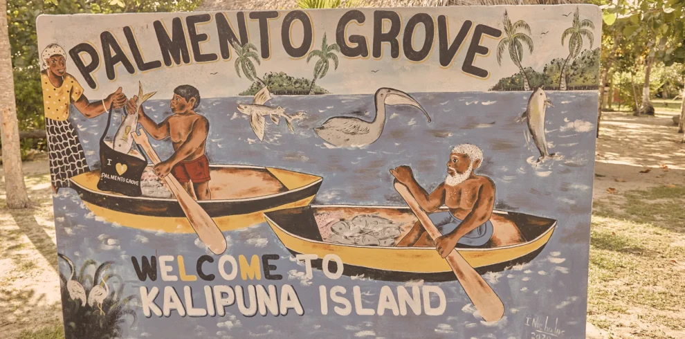 The hand-painted Welcome to Kalipuna Island sign at Palmento Grove, Hopkins, Belize