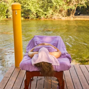 A massage table set on the lagoon deck at Palmento Grove, Hopkins, Belize