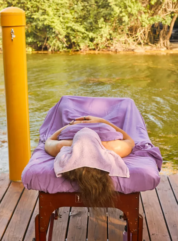 A massage table set on the lagoon deck at Palmento Grove, Hopkins, Belize